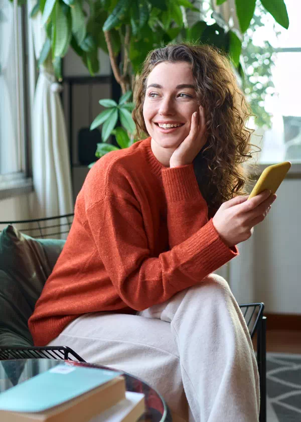 Smiling woman with phone